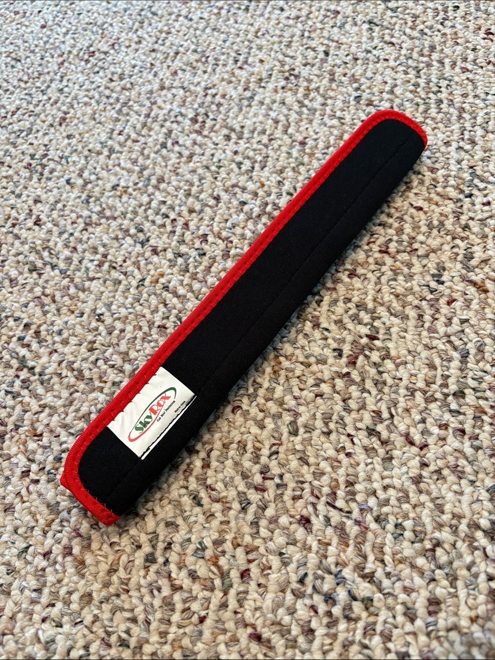 Sky Rox Black and Red Padded Seat Belt Cover. NWOT